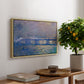 Charing Cross Bridge, 1903 by Claude Monet, presented in a natural wood floater framed canvas featuring an impressionist view of bridge stretching across river with soft light and haze, displayed above a hallway console table.