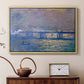 Natural wood floater framed canvas featuring an atmospheric depiction of London bridge with reflections in water, displayed above a cabinet in a soft-toned living room.