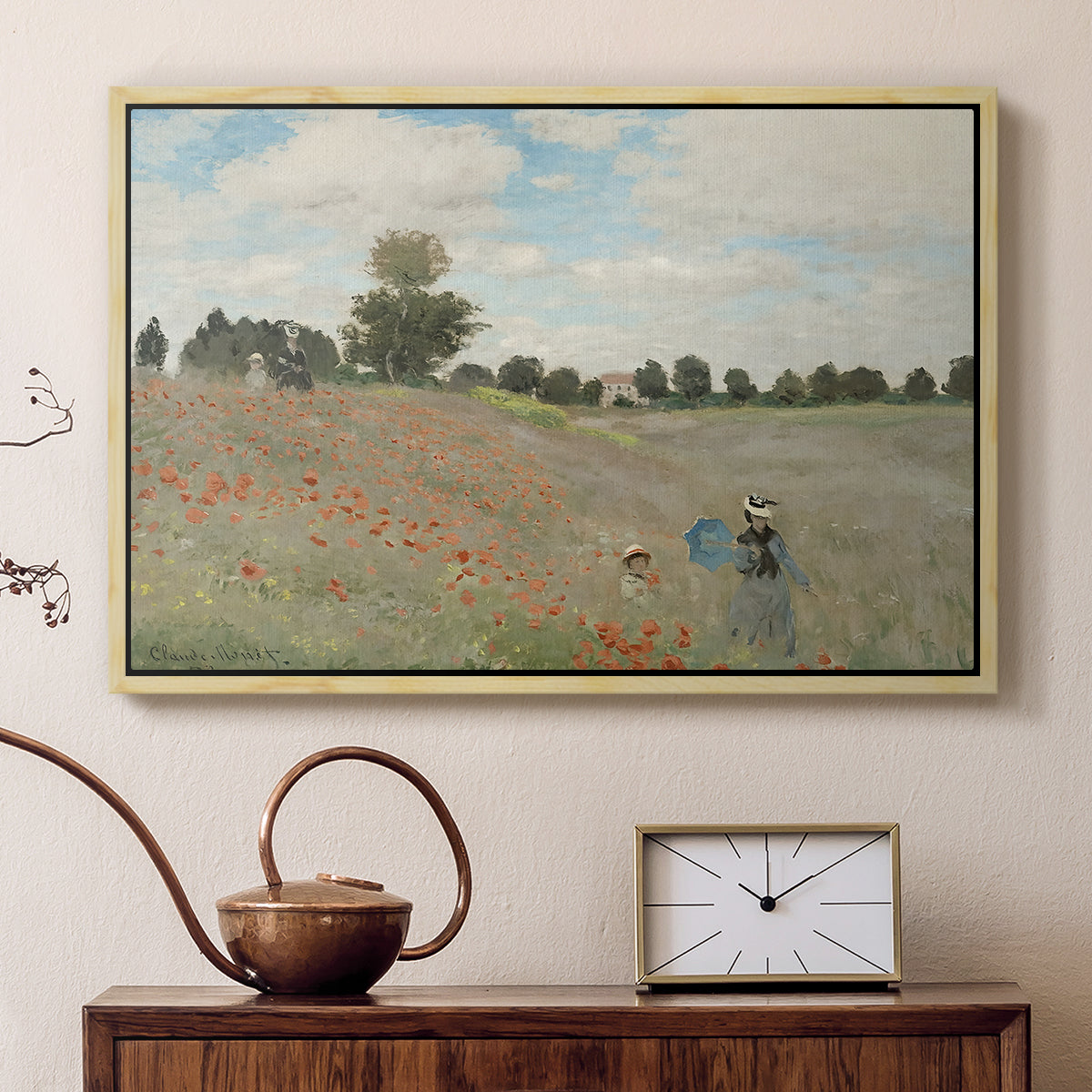 Natural wood floater framed canvas featuring a bright meadow filled with poppies under open sky, displayed above a cabinet in a soft-toned living room.