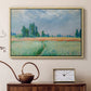 Natural wood floater framed canvas featuring an agricultural landscape with tall wheat and distant horizon, displayed above a cabinet in a soft-toned living room.