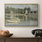The Bridge at Argenteuil, 1874 by Claude Monet in a natural wood floater framed canvas displayed above a console table in a hallway, featuring a riverside view with architecture and nautical activity.