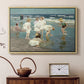 Natural wood floater framed canvas featuring an impressionist coastal view of families enjoying seaside water, displayed above a cabinet in a soft-toned living room.