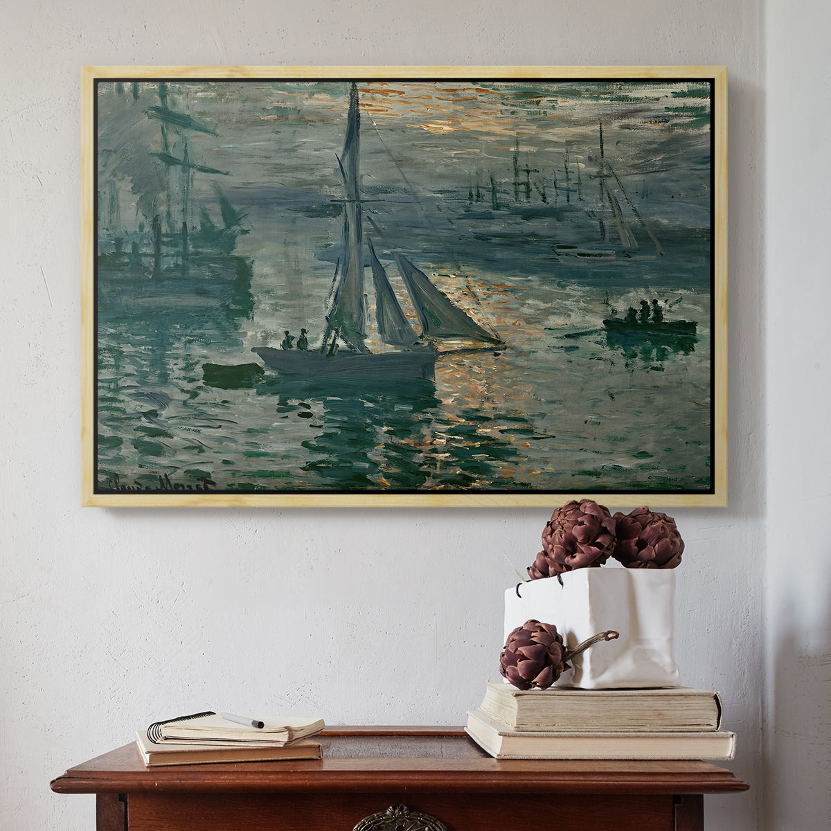 Natural wood floater framed canvas featuring Sunrise (Marine), 1873 by Claude Monet above an entryway table in a minimalist foyer.