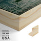Close-up of the natural wood floater frame corner and gallery wrapped canvas construction.