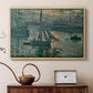Natural wood floater framed canvas featuring an early morning harbor scene with boats and diffused light, displayed above a cabinet in a soft-toned living room.