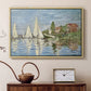 Natural wood floater framed canvas featuring an impressionist depiction of sailing competition on water, displayed above a cabinet in a soft-toned living room.
