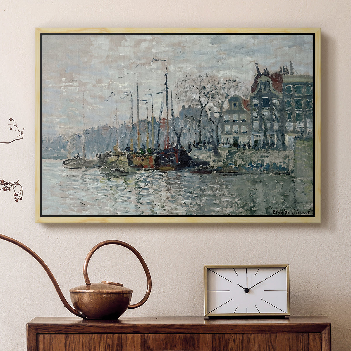 Natural wood floater framed canvas featuring an urban waterway with docked boats and European buildings, displayed above a cabinet in a soft-toned living room.