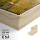 Close-up of the natural wood floater frame corner and gallery wrapped canvas construction.