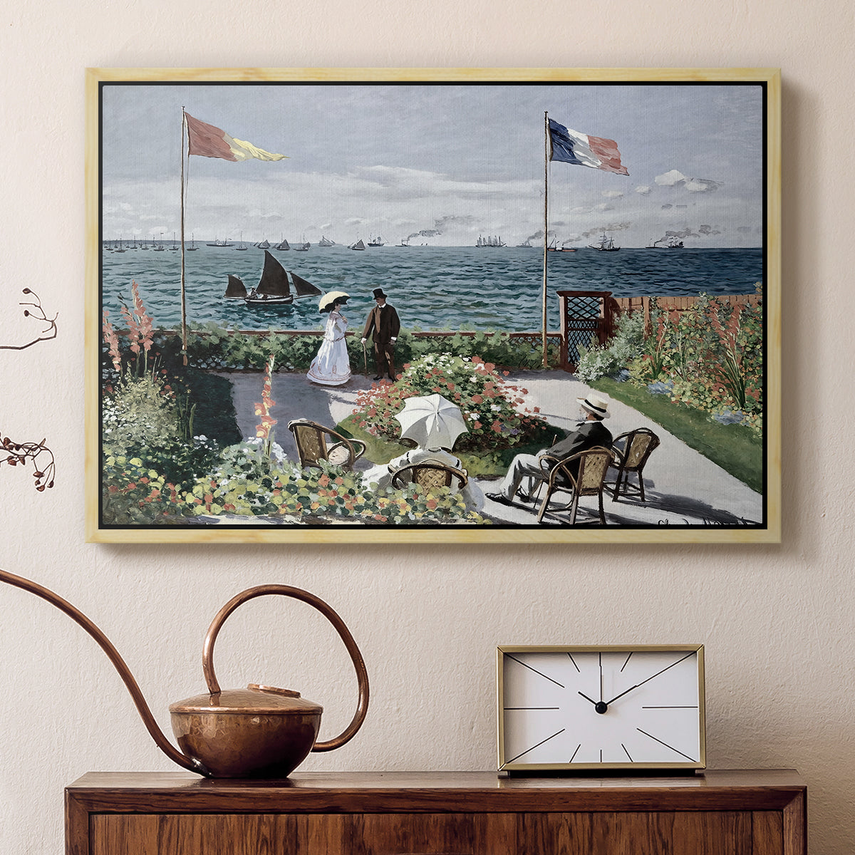 Natural wood floater framed canvas featuring a vibrant garden scene with colorful blooms and distant sea, displayed above a cabinet in a soft-toned living room.