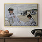 On the Beach at Trouville, 1870 by Claude Monet in a natural wood floater framed canvas displayed above a console table in a hallway, featuring a coastal leisure scene with figures looking out to sea.