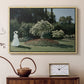 Natural wood floater framed canvas featuring an elegant woman posed outdoors among blooming plants, displayed above a cabinet in a soft-toned living room.