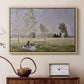 Natural wood floater framed canvas featuring a sunlit meadow with woman surrounded by greenery, displayed above a cabinet in a soft-toned living room.