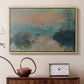 Natural wood floater framed canvas featuring an impressionist view of river at sunset with snowy banks, displayed above a cabinet in a soft-toned living room.