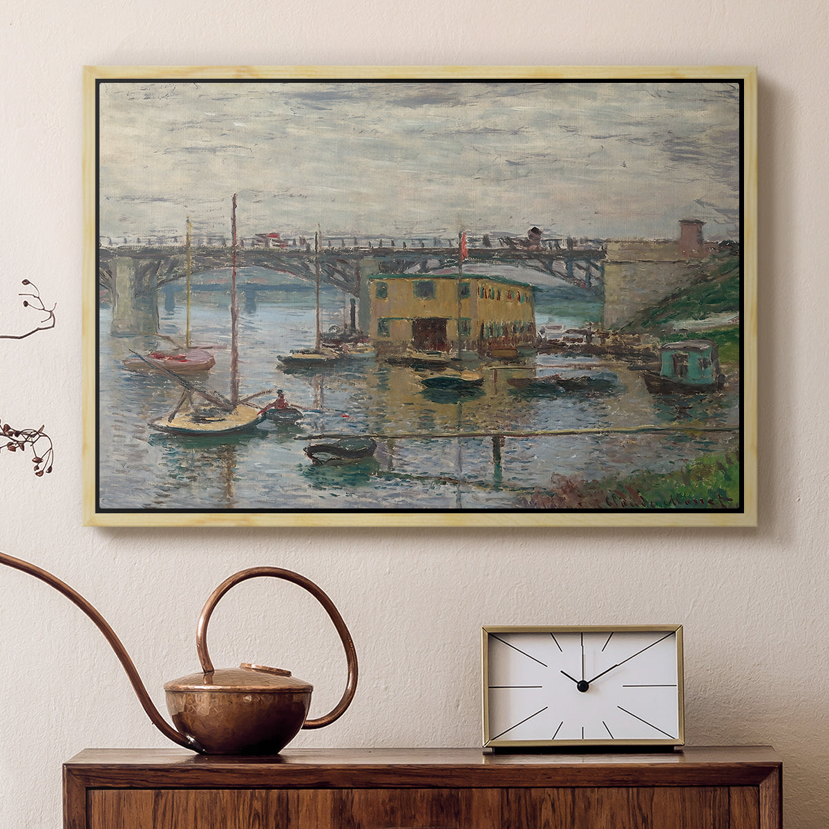 Natural wood floater framed canvas featuring a calm water scene with bridge fading into cloudy sky, displayed above a cabinet in a soft-toned living room.