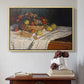 Natural wood floater framed canvas featuring Still Life with Apples and Grapes, 1880 by Claude Monet above an entryway table in a minimalist foyer.