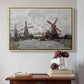 Natural wood floater framed canvas featuring Windmills near Zaandam, 1871 by Claude Monet above an entryway table in a minimalist foyer.
