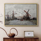 Natural wood floater framed canvas featuring a countryside scene with traditional windmills and reflections, displayed above a cabinet in a soft-toned living room.