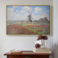Natural wood floater framed canvas featuring Tulip Fields with the Rijnsburg Windmill, 1886 by Claude Monet above an entryway table in a minimalist foyer.