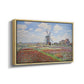 Angled view of Tulip Fields with the Rijnsburg Windmill, 1886 by Claude Monet in a natural wood floater framed canvas.