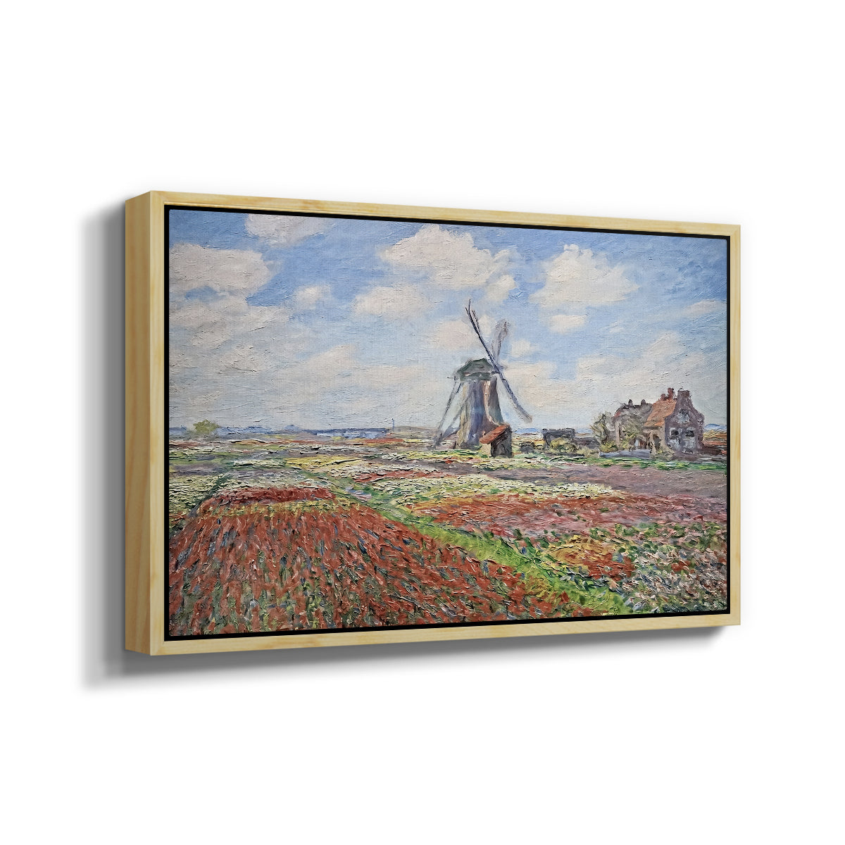 Angled view of Tulip Fields with the Rijnsburg Windmill, 1886 by Claude Monet in a natural wood floater framed canvas.