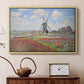 Natural wood floater framed canvas featuring an impressionist field of blooming tulips under bright sky, displayed above a cabinet in a soft-toned living room.