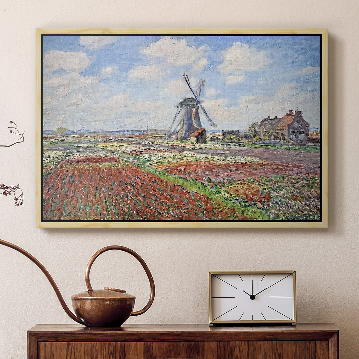 Natural wood floater framed canvas featuring an impressionist field of blooming tulips under bright sky, displayed above a cabinet in a soft-toned living room.