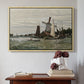 Natural wood floater framed canvas featuring Windmill at Zaandam, 1871 by Claude Monet above an entryway table in a minimalist foyer.