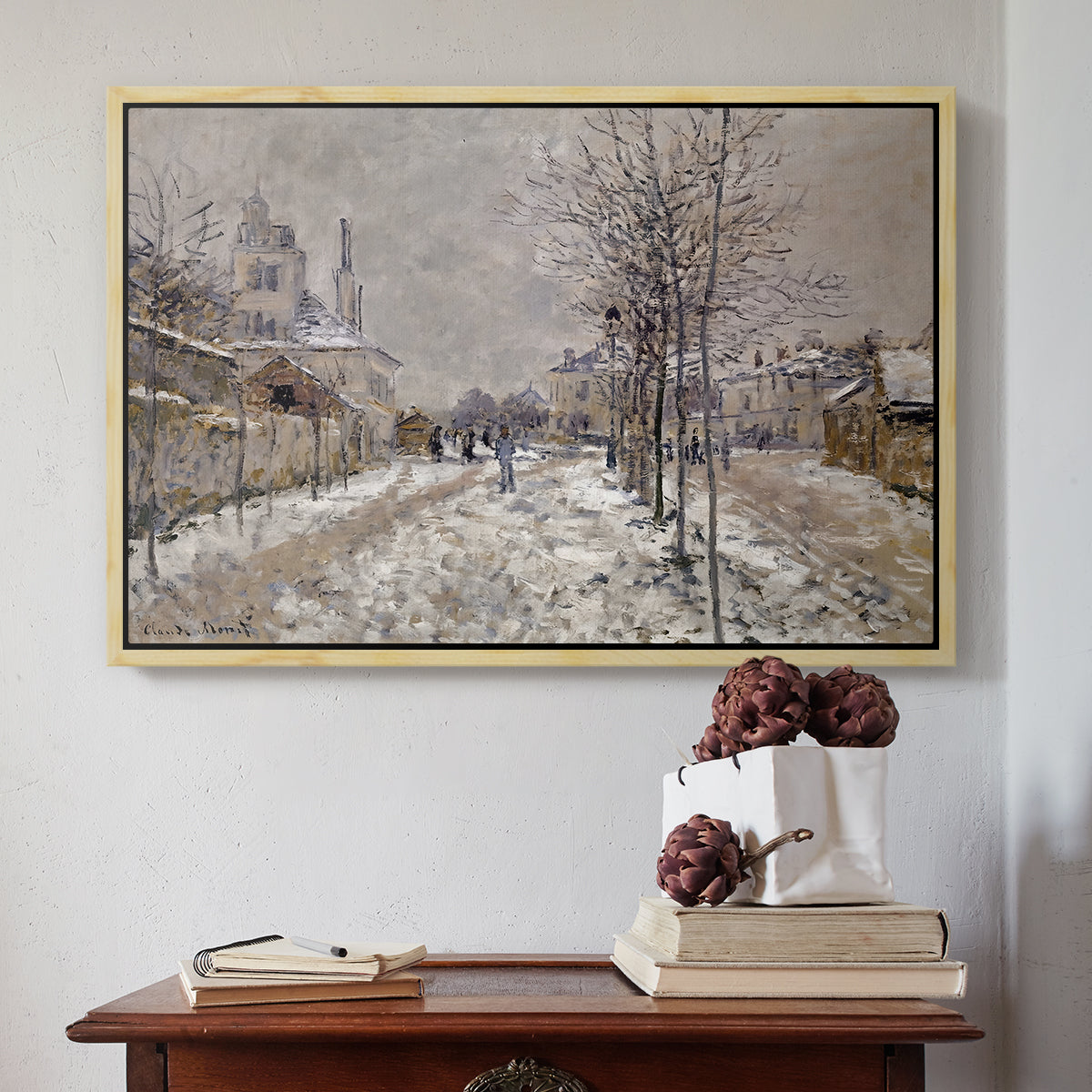 Natural wood floater framed canvas featuring The Boulevard de Pontoise at Argenteuil, Snow Effect, 1875 by Claude Monet above an entryway table in a minimalist foyer.