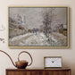 Natural wood floater framed canvas featuring a quiet boulevard blanketed in snow with distant figures, displayed above a cabinet in a soft-toned living room.