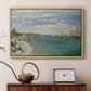 Natural wood floater framed canvas featuring an impressionist coastal view with colorful sails and shoreline activity, displayed above a cabinet in a soft-toned living room.