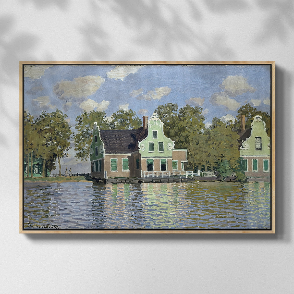 Front view of Houses on the Zaan River at Zaandam, 1871 by Claude Monet in a natural wood floater framed canvas.