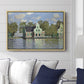 Houses on the Zaan River at Zaandam, 1871 by Claude Monet displayed above a sofa in a living room in a natural wood floater frame, featuring an impressionist riverside village with colorful buildings.