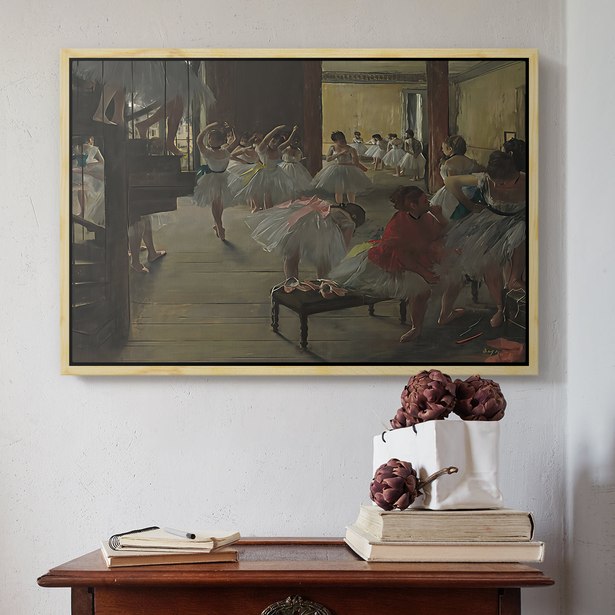 Natural wood floater framed canvas featuring The Dance Class, c. 1873 by Edgar Degas above an entryway table in a minimalist foyer.