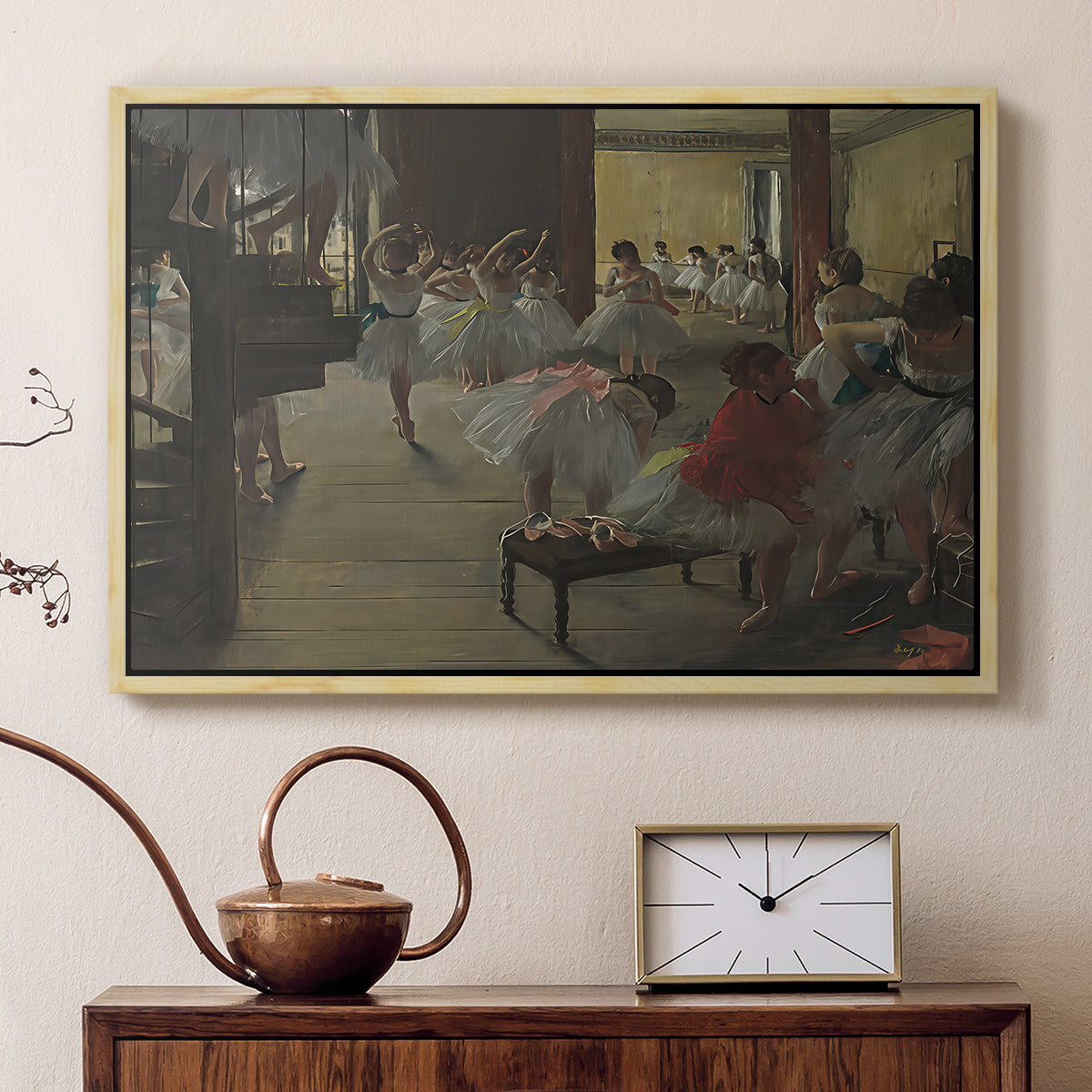 Natural wood floater framed canvas featuring an impressionist studio interior filled with ballet students, displayed above a cabinet in a soft-toned living room.