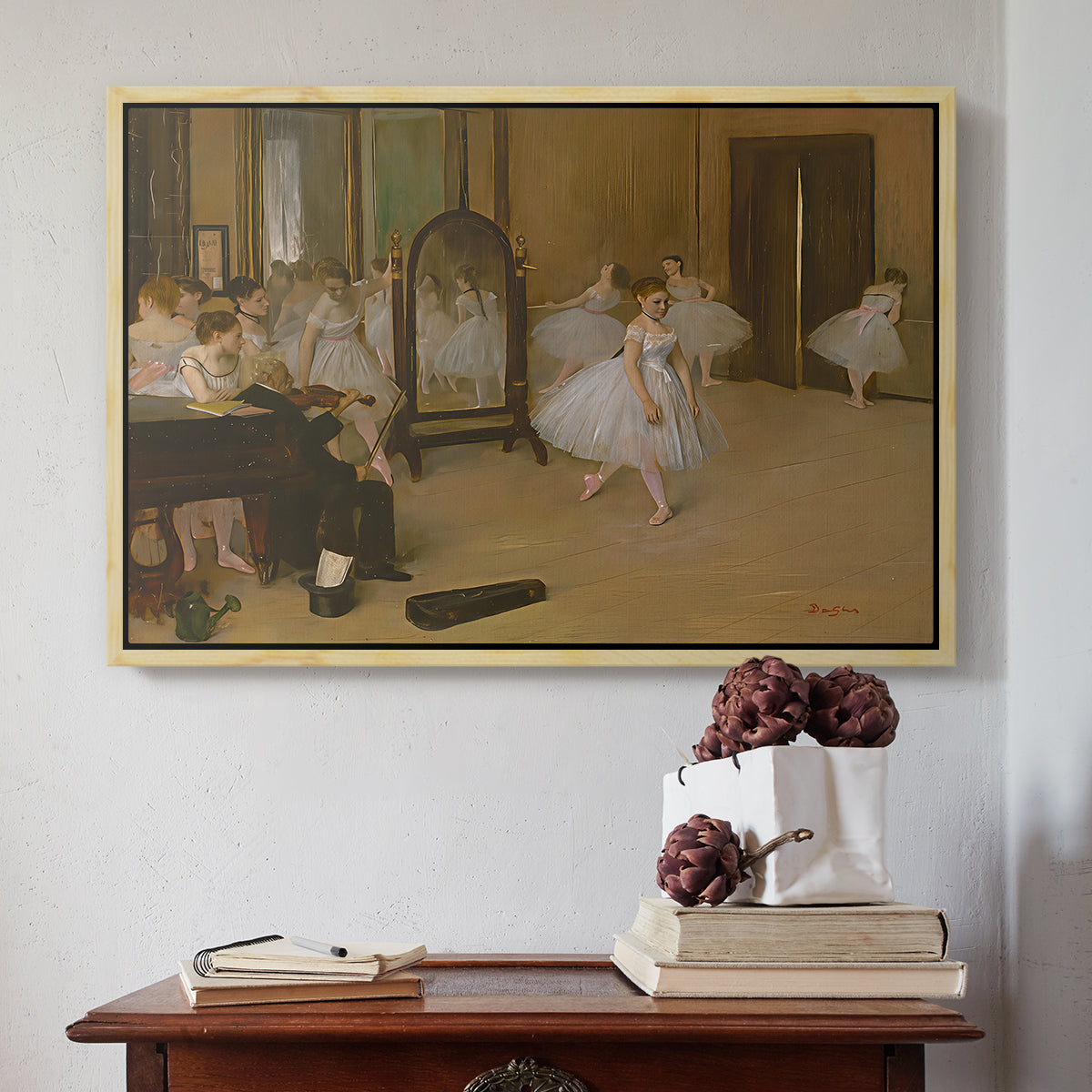 Natural wood floater framed canvas featuring The Dancing Class, c. 1870 by Edgar Degas above an entryway table in a minimalist foyer.