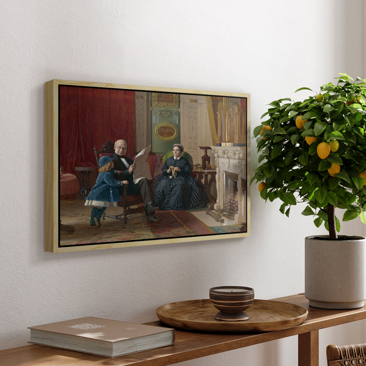 The Brown Family, 1869 by Eastman Johnson, presented in a natural wood floater framed canvas featuring a family seated together in interior room engaged in quiet activity, displayed above a hallway console table.