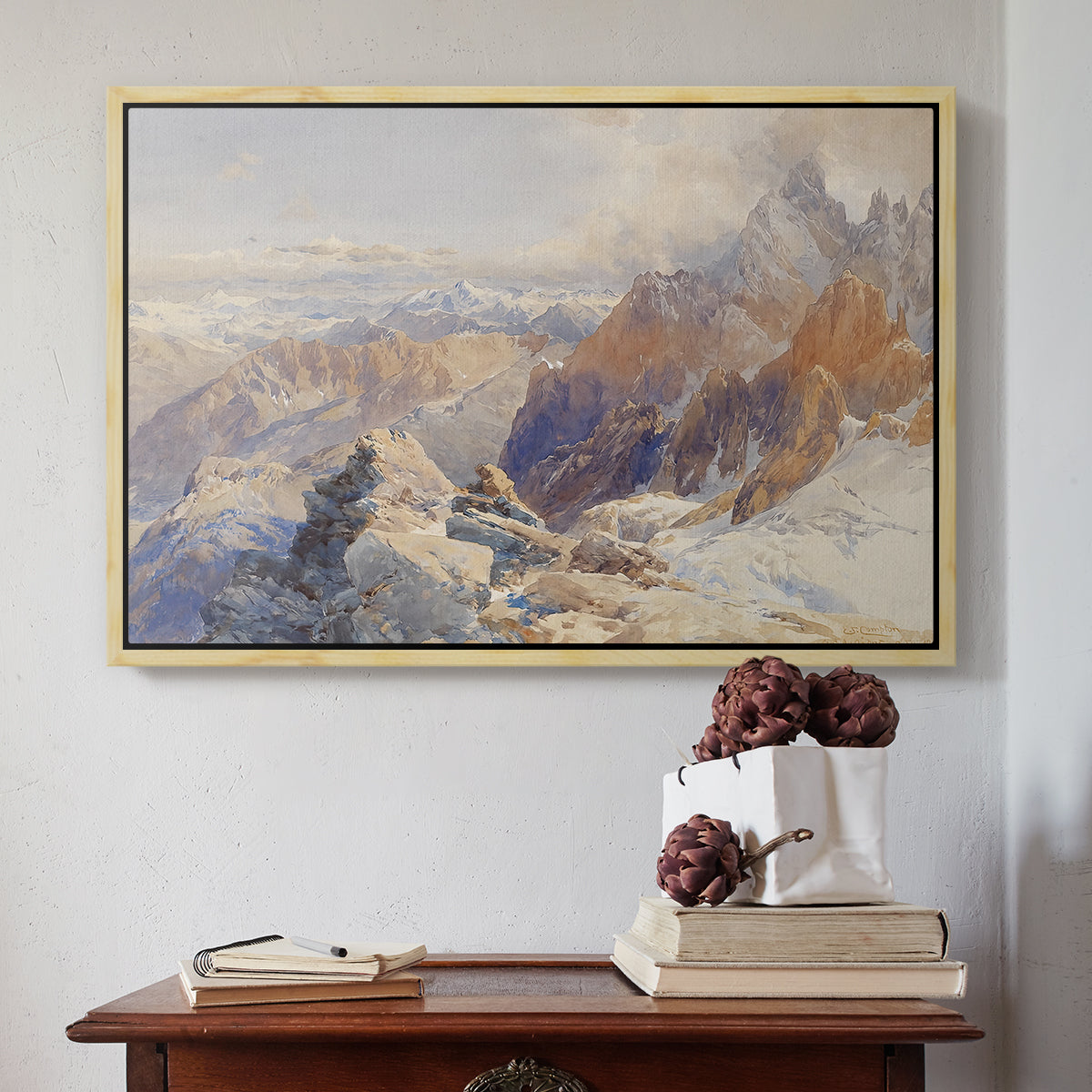 Natural wood floater framed canvas featuring Col du Géant, 1903 by Edward Theodore Compton above an entryway table in a minimalist foyer.