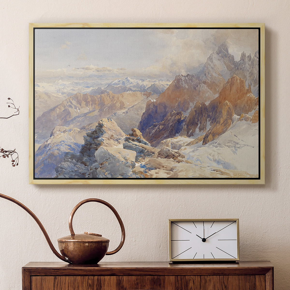 Natural wood floater framed canvas featuring a panoramic alpine view with snow and rocky cliffs, displayed above a cabinet in a soft-toned living room.