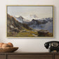 The Großglockner from the Prager Hut, 1890 by Edward Theodore Compton in a natural wood floater framed canvas displayed above a console table in a hallway, featuring a scenic mountain view with dramatic elevation and depth.