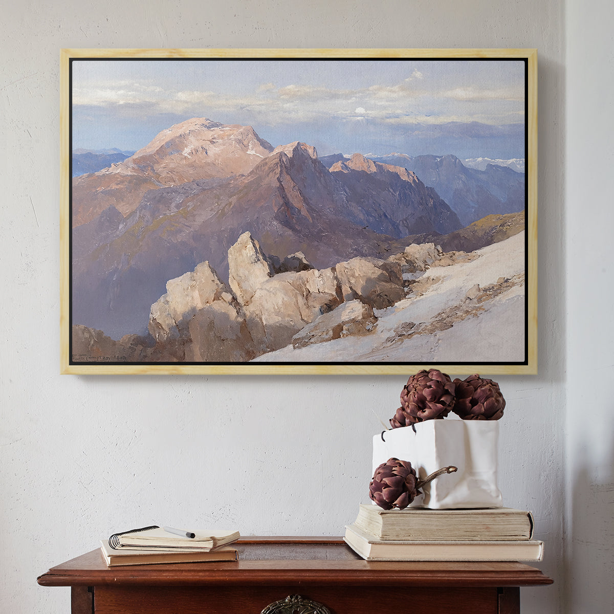 Natural wood floater framed canvas featuring Hoher Göll from Watzmann-Hocheck, 1919 by Edward Theodore Compton above an entryway table in a minimalist foyer.