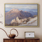 Natural wood floater framed canvas featuring a high vantage point overlooking rugged mountain terrain, displayed above a cabinet in a soft-toned living room.