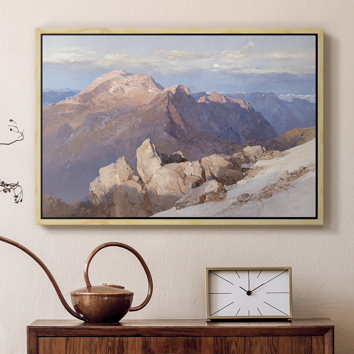 Natural wood floater framed canvas featuring a high vantage point overlooking rugged mountain terrain, displayed above a cabinet in a soft-toned living room.
