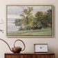 Natural wood floater framed canvas featuring a natural setting with water, trees, and open sky, displayed above a cabinet in a soft-toned living room.