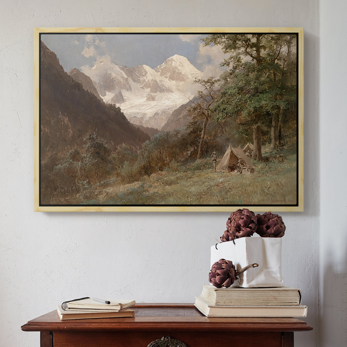 Natural wood floater framed canvas featuring Landscape in the Caucasus, c. 1921 by Edward Theodore Compton above an entryway table in a minimalist foyer.