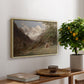 Landscape in the Caucasus, c. 1921 by Edward Theodore Compton, presented in a natural wood floater framed canvas featuring a mountainous landscape with rugged terrain and distant peaks, displayed above a hallway console table.