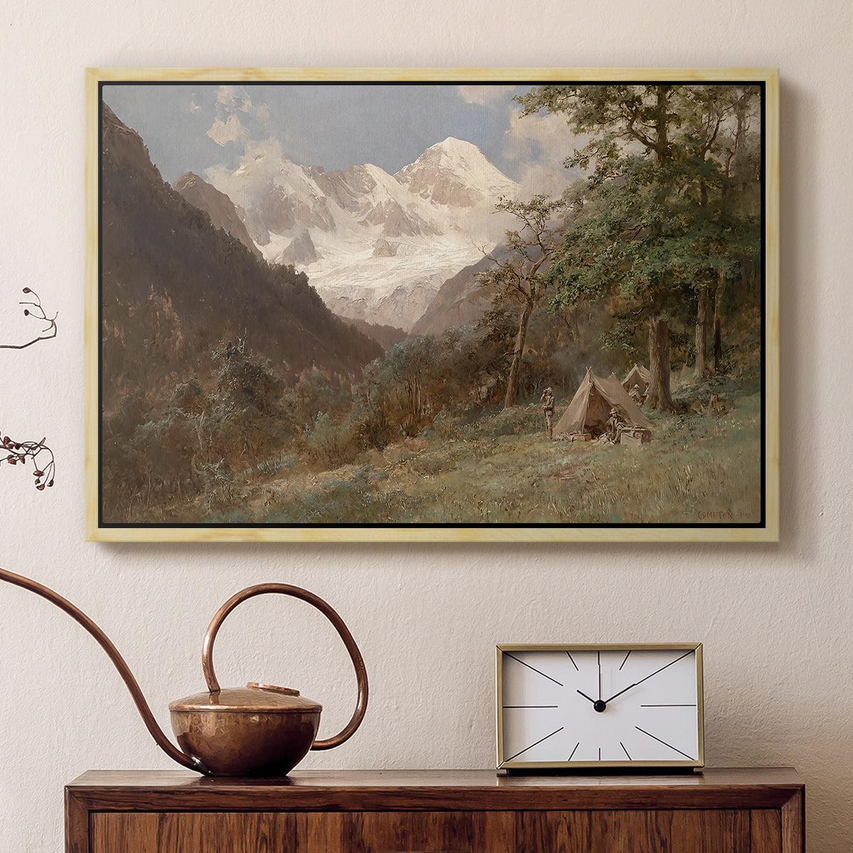 Natural wood floater framed canvas featuring a natural scene with valleys and rocky formations, displayed above a cabinet in a soft-toned living room.