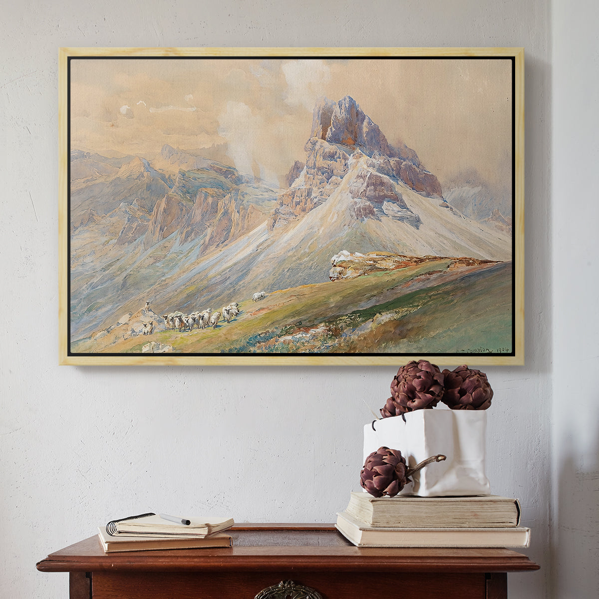 Natural wood floater framed canvas featuring From the Dolomites, 1904 by Edward Theodore Compton above an entryway table in a minimalist foyer.