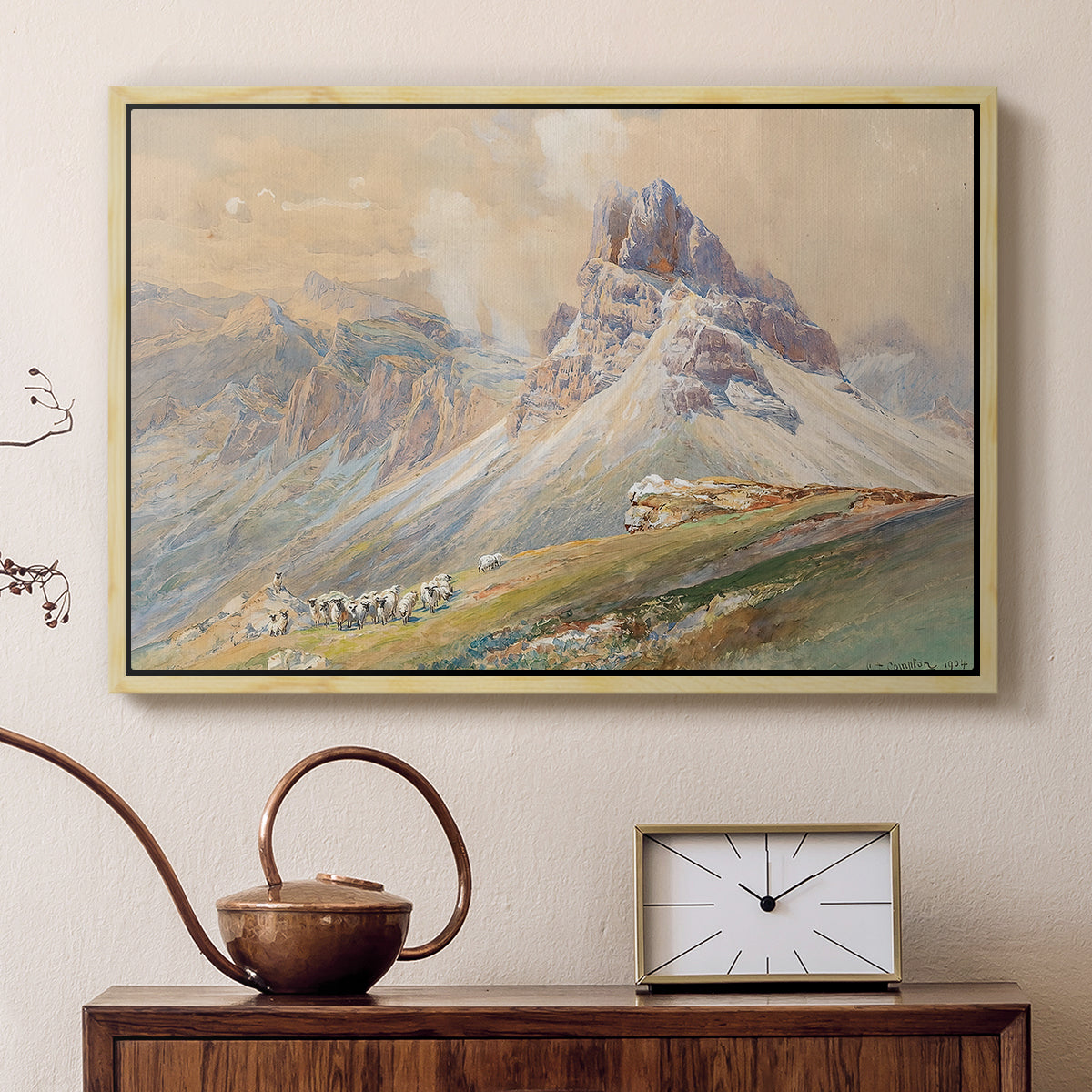 Natural wood floater framed canvas featuring an expansive landscape featuring iconic Dolomite peaks, displayed above a cabinet in a soft-toned living room.