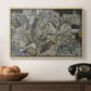 Mödling II, 1918 by Egon Schiele in a natural wood floater framed canvas displayed above a console table in a hallway, featuring a stylized urban composition with geometric structures and muted tones.