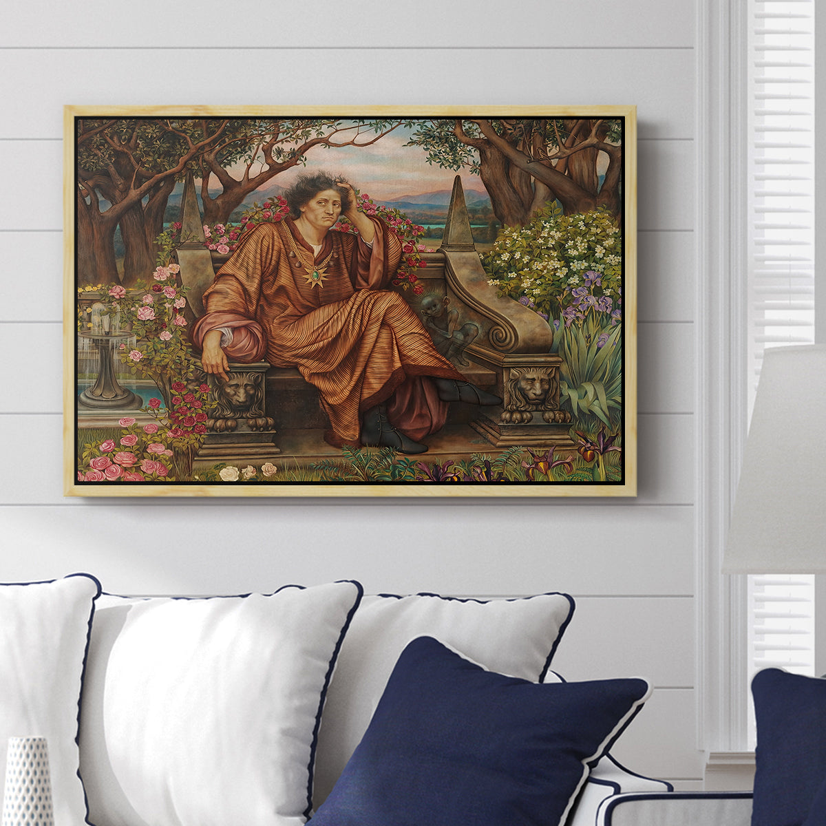 A Soul in Hell, c. 1901-1902 by Evelyn De Morgan displayed above a sofa in a living room in a natural wood floater frame, featuring a dramatic allegory of suffering with figure engulfed in fiery environment.